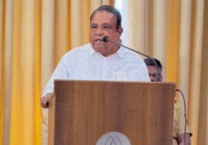 Bhausaheb Wakchaure speaking at formal conference podium
