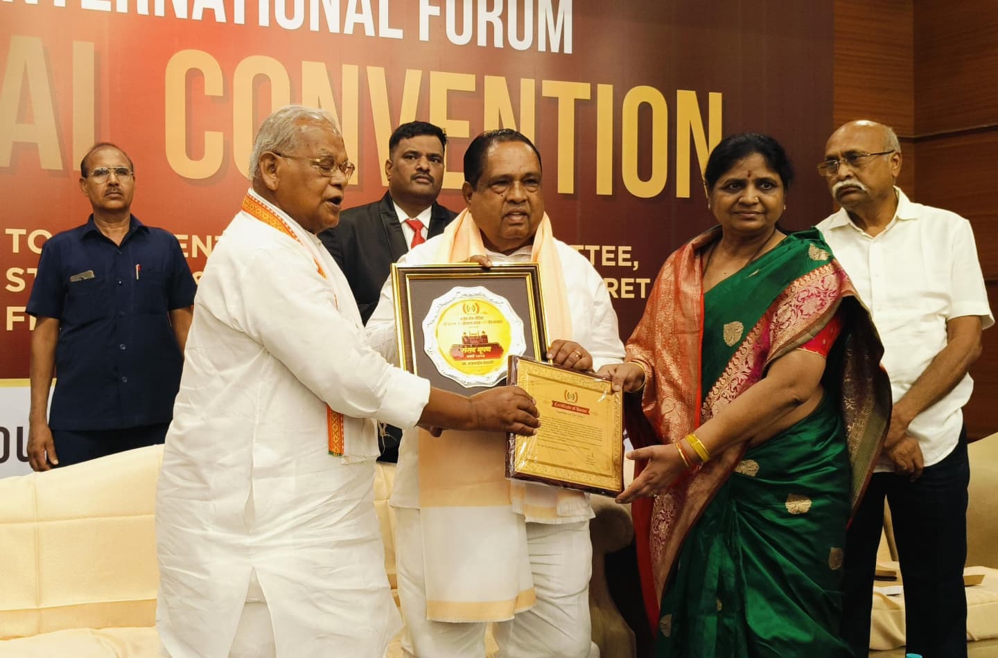 Bhausaheb Wakchaure receiving national recognition award at convention
