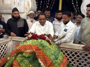 MP Wakchaure paying floral tribute during religious ceremony