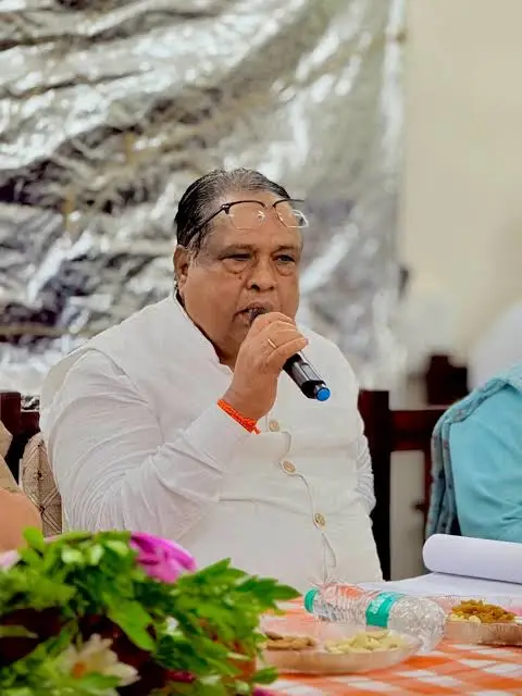 Bhausaheb Wakchaure attending official meeting session